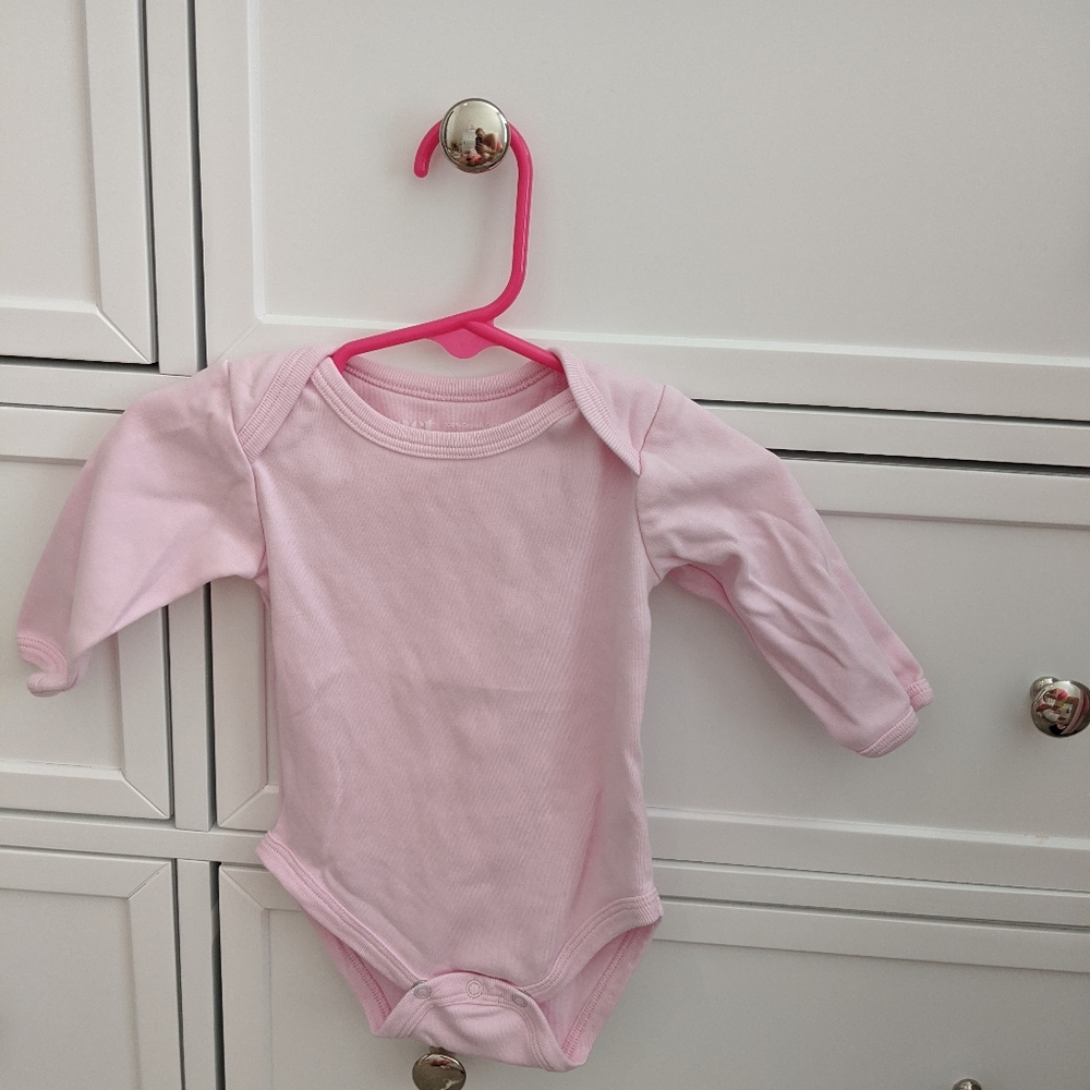 Pact pink onesie